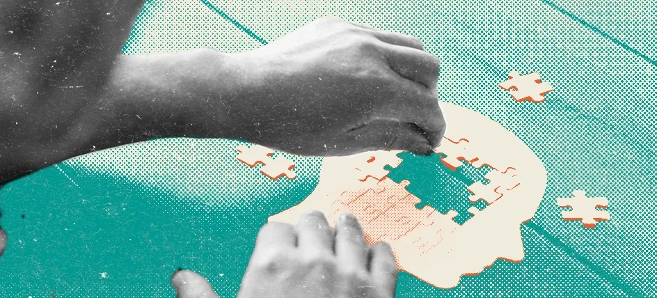 Person assembling a puzzle shaped like a human head, symbolizing brain health, memory, and cognitive function.