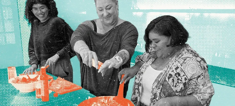 three women cooking vegetables