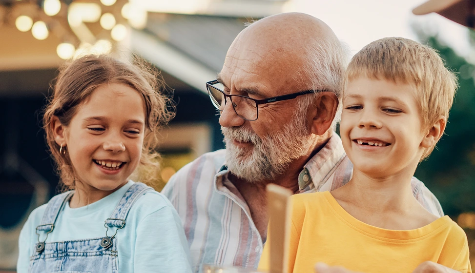 Older man with two children